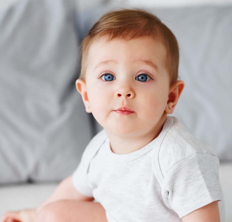Baby with brown hair and blue eyes